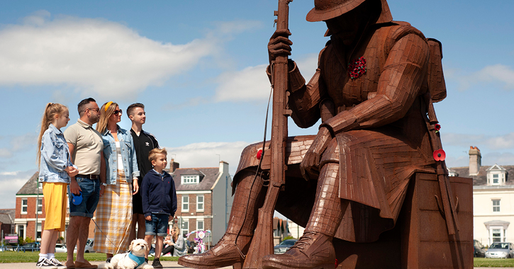 family standing next to 1101 sculpture at Seaham on the Durham Heritage Coast